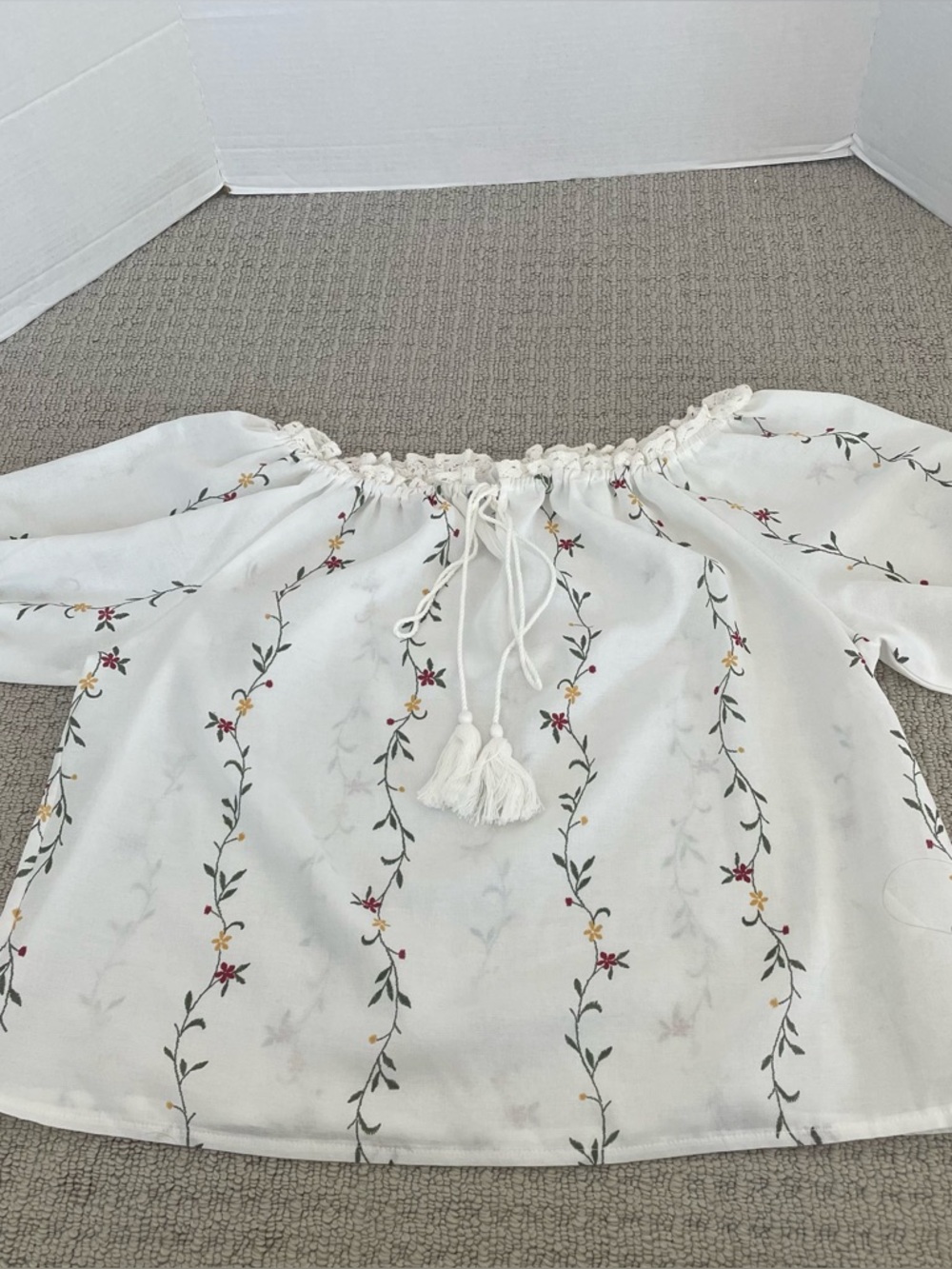 Women’s white blouse with embroidered flowers